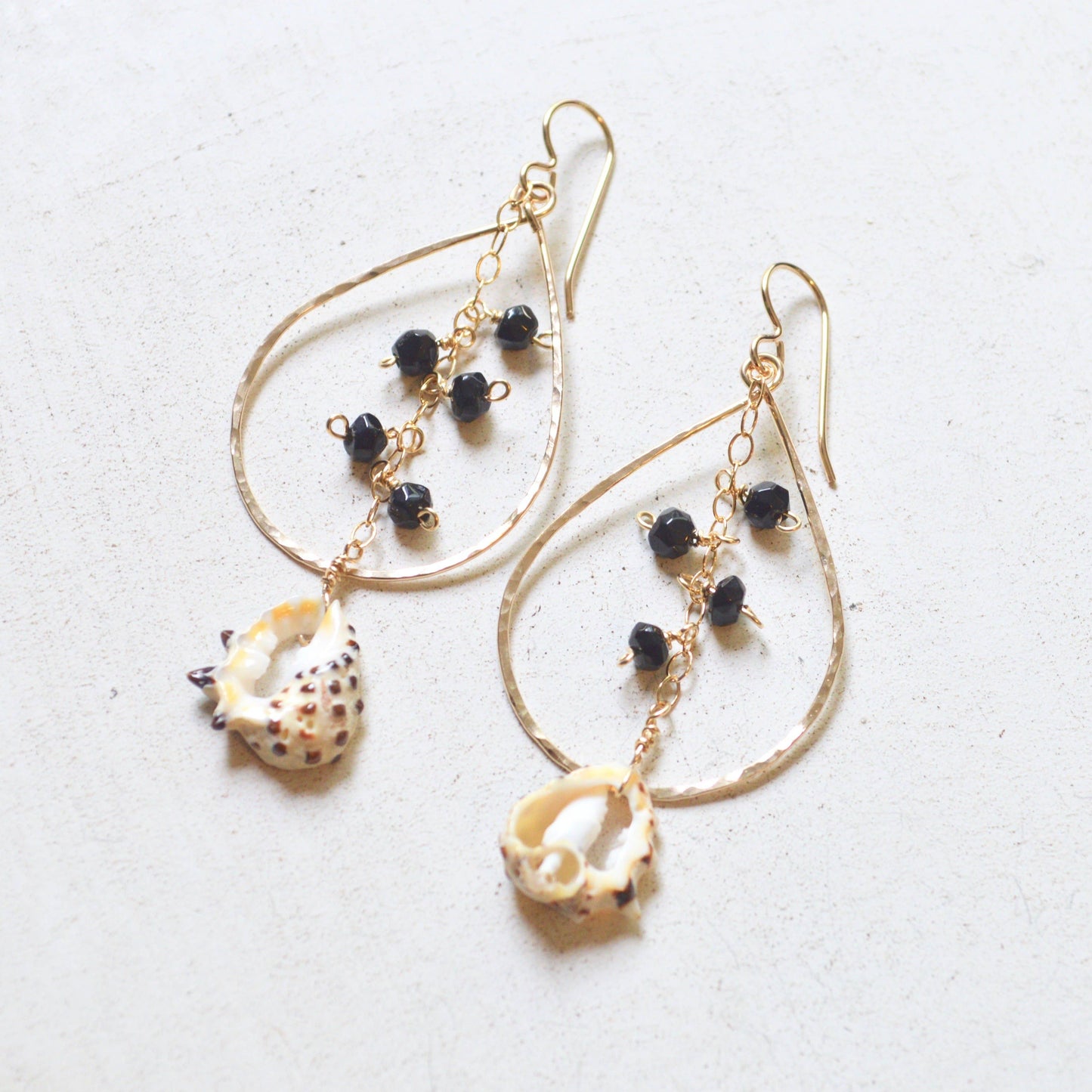 Black Onyx & Drupa Shell Teardrop Earrings in Gold