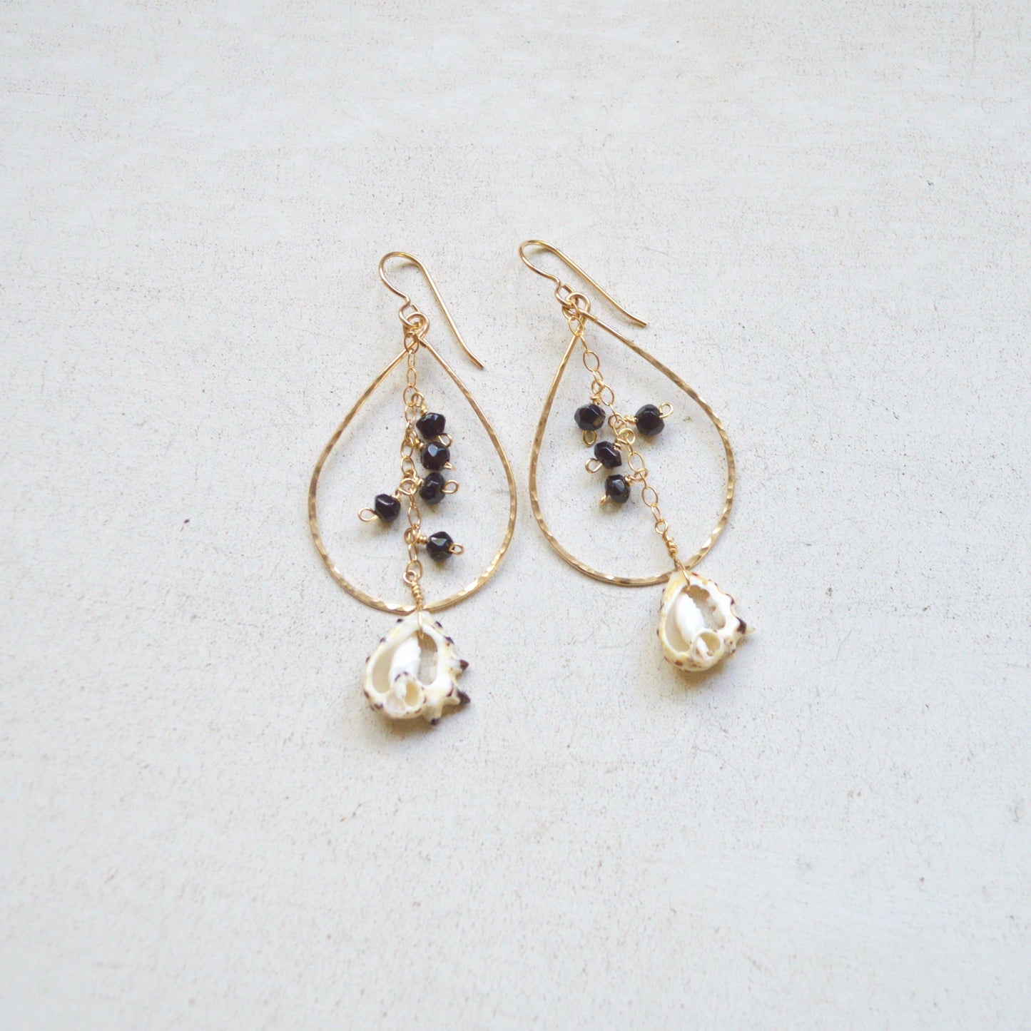 Black Onyx & Drupa Shell Teardrop Earrings in Gold