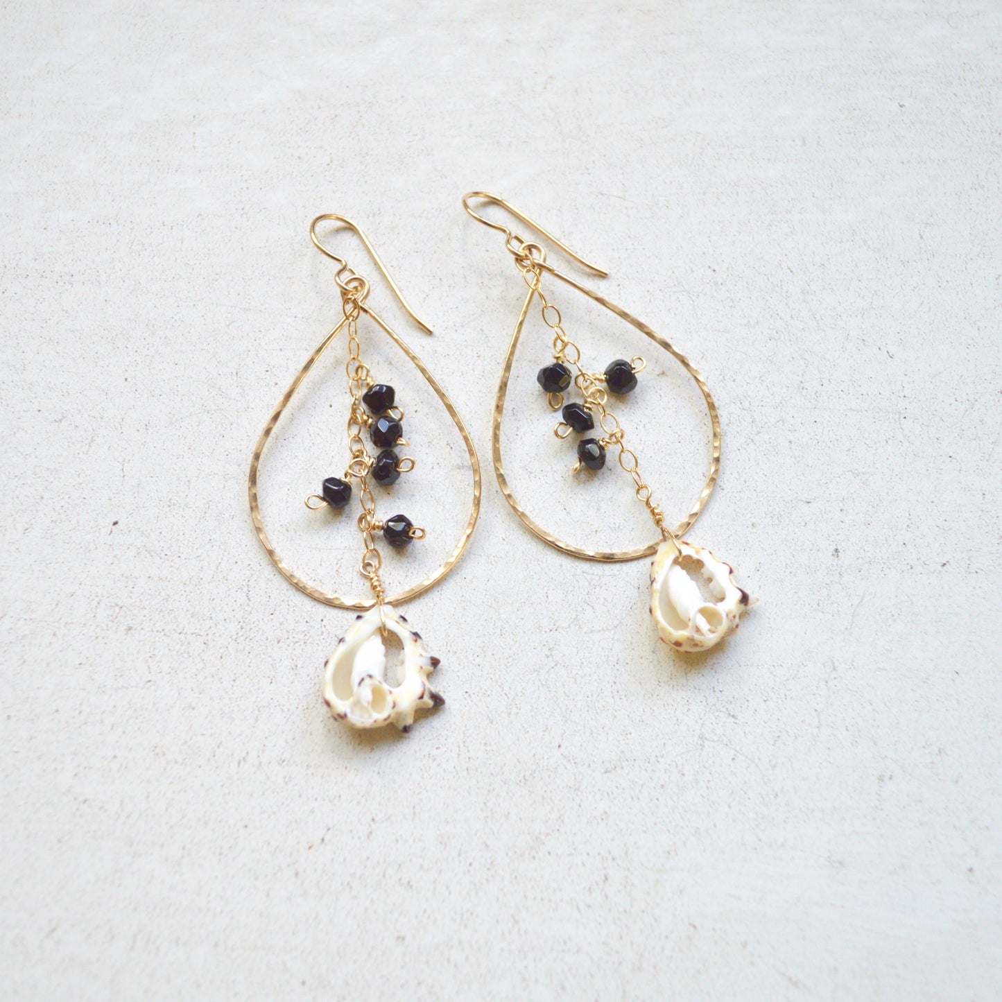 Black Onyx & Drupa Shell Teardrop Earrings in Gold